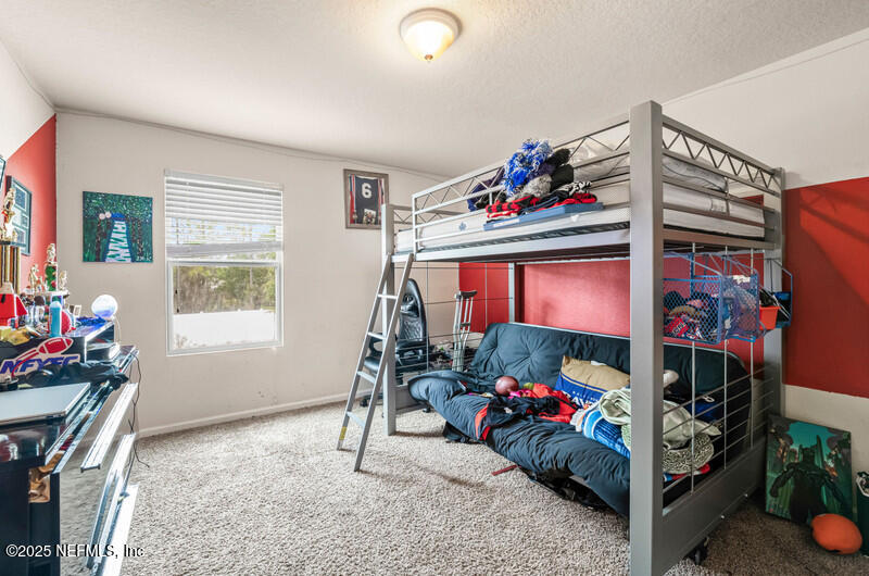 4076 Great Falls Loop Middleburg, FL 32068 - Photo 22 of 30 a view of a room with gym equipment