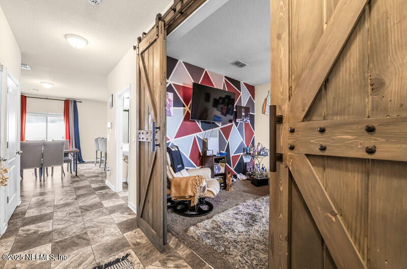 4076 Great Falls Loop Middleburg, FL 32068 - Photo 7 of 30 a view of a room with gym equipment