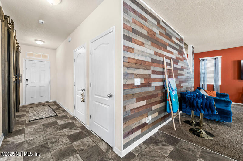 4076 Great Falls Loop Middleburg, FL 32068 - Photo 9 of 30 a view of a hallway with workspace and a window