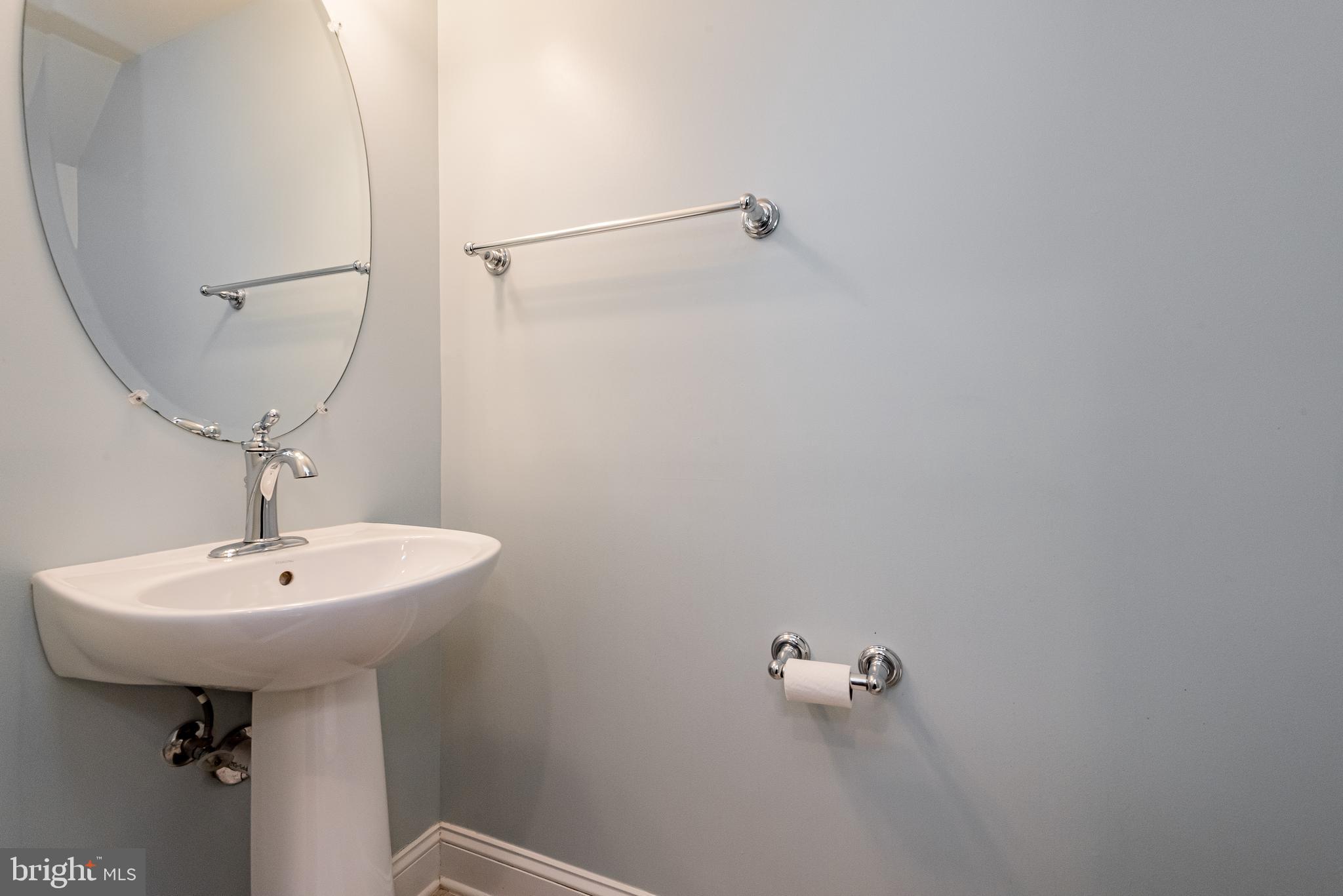 20654 Sibbald Square Ashburn, VA 20147 - Photo 19 of 43 a bathroom with a sink a toilet
