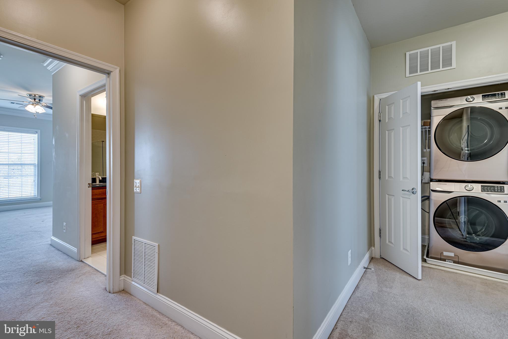 20654 Sibbald Square Ashburn, VA 20147 - Photo 32 of 43 a view of a hallway with washer and dryer