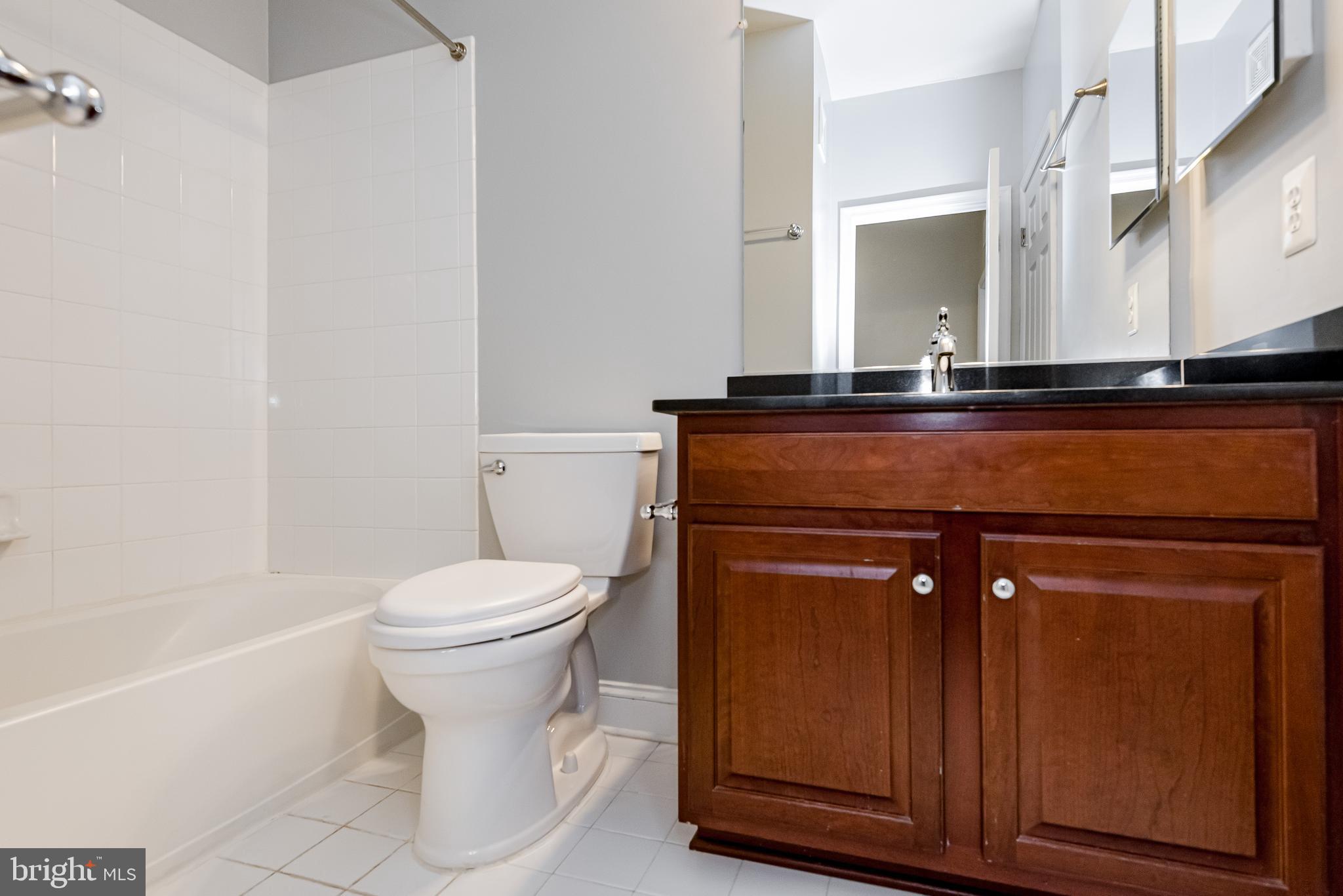 20654 Sibbald Square Ashburn, VA 20147 - Photo 35 of 43 a bathroom with a toilet a sink and bathtub