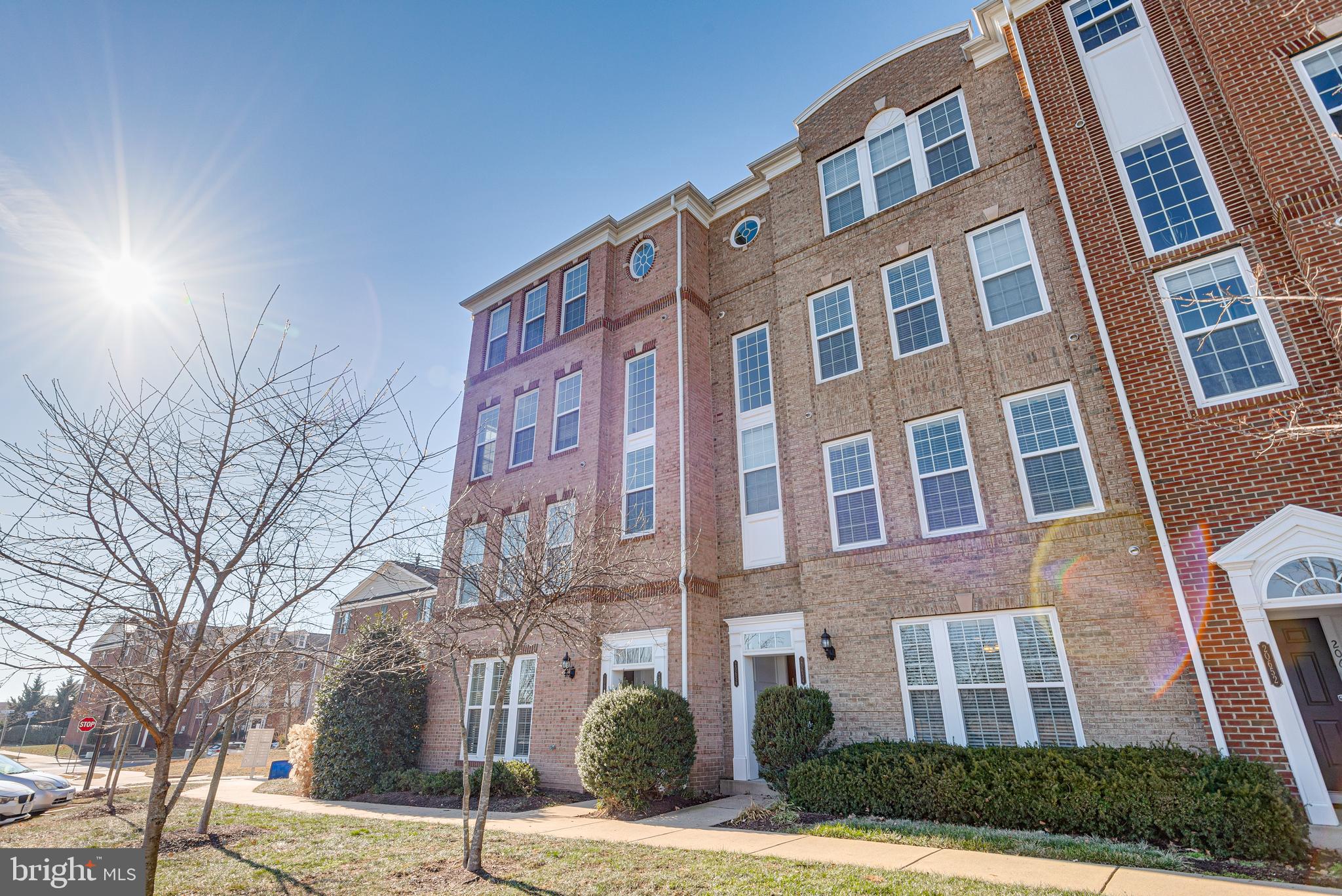20654 Sibbald Square Ashburn, VA 20147 - Photo 5 of 43 a front view of a multi story building