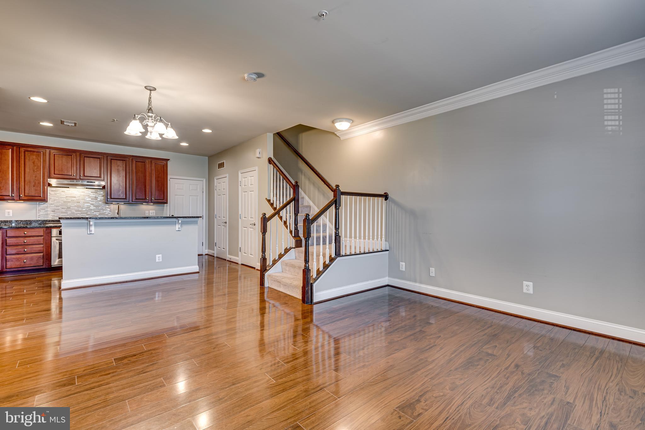 20654 Sibbald Square Ashburn, VA 20147 - Photo 8 of 43 a view of a kitchen with wooden floor and a kitchen