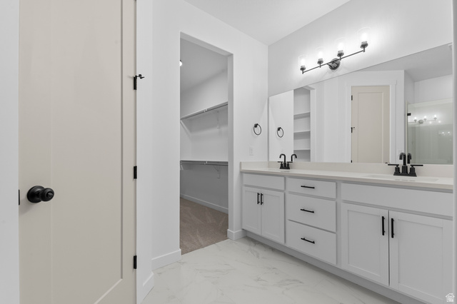 3016 West 2650 North Clinton, UT 84015 - Photo 18 of 20 Bathroom with light marble finish floors, double vanity, and a walk in closet