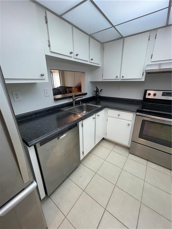 740 South Federal Highway, Unit 312 Pompano Beach, FL 33062 - Photo 11 of 43 a kitchen with cabinets and appliances