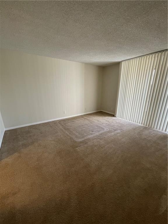 740 South Federal Highway, Unit 312 Pompano Beach, FL 33062 - Photo 13 of 43 an empty room with windows