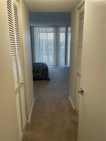 a bathroom with a window and a shower
