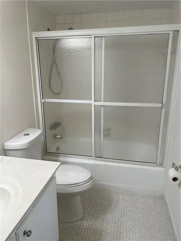a bathroom with a toilet and a sink