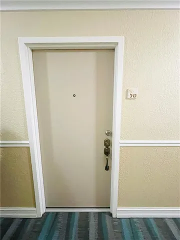 a view of a swimming pool and an outdoor seating