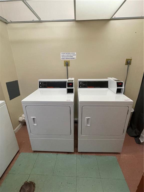 740 South Federal Highway, Unit 312 Pompano Beach, FL 33062 - Photo 41 of 43 a utility room with dryer and washer