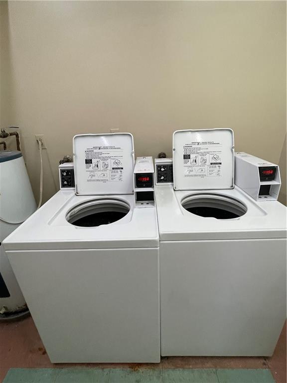 740 South Federal Highway, Unit 312 Pompano Beach, FL 33062 - Photo 42 of 43 a utility room with dryer and washer