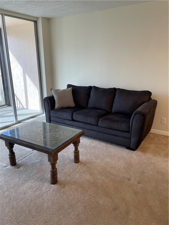 740 South Federal Highway, Unit 312 Pompano Beach, FL 33062 - Photo 5 of 43 a living room with furniture and a window