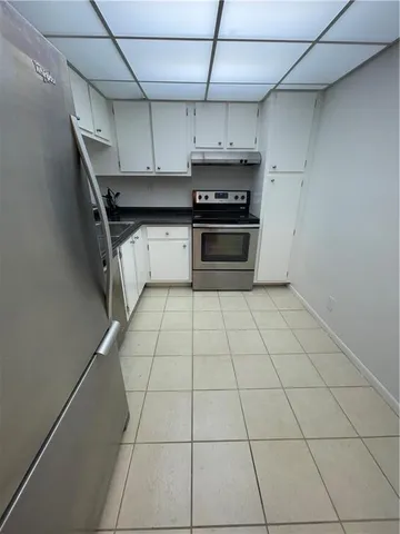 a kitchen with stainless steel appliances a sink and cabinets