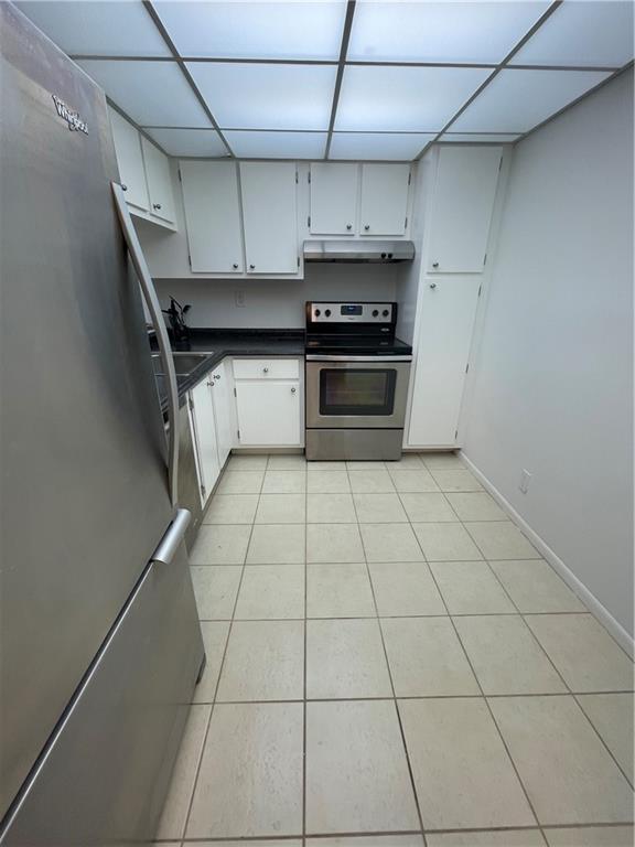 740 South Federal Highway, Unit 312 Pompano Beach, FL 33062 - Photo 10 of 43 a kitchen with stainless steel appliances a sink and cabinets