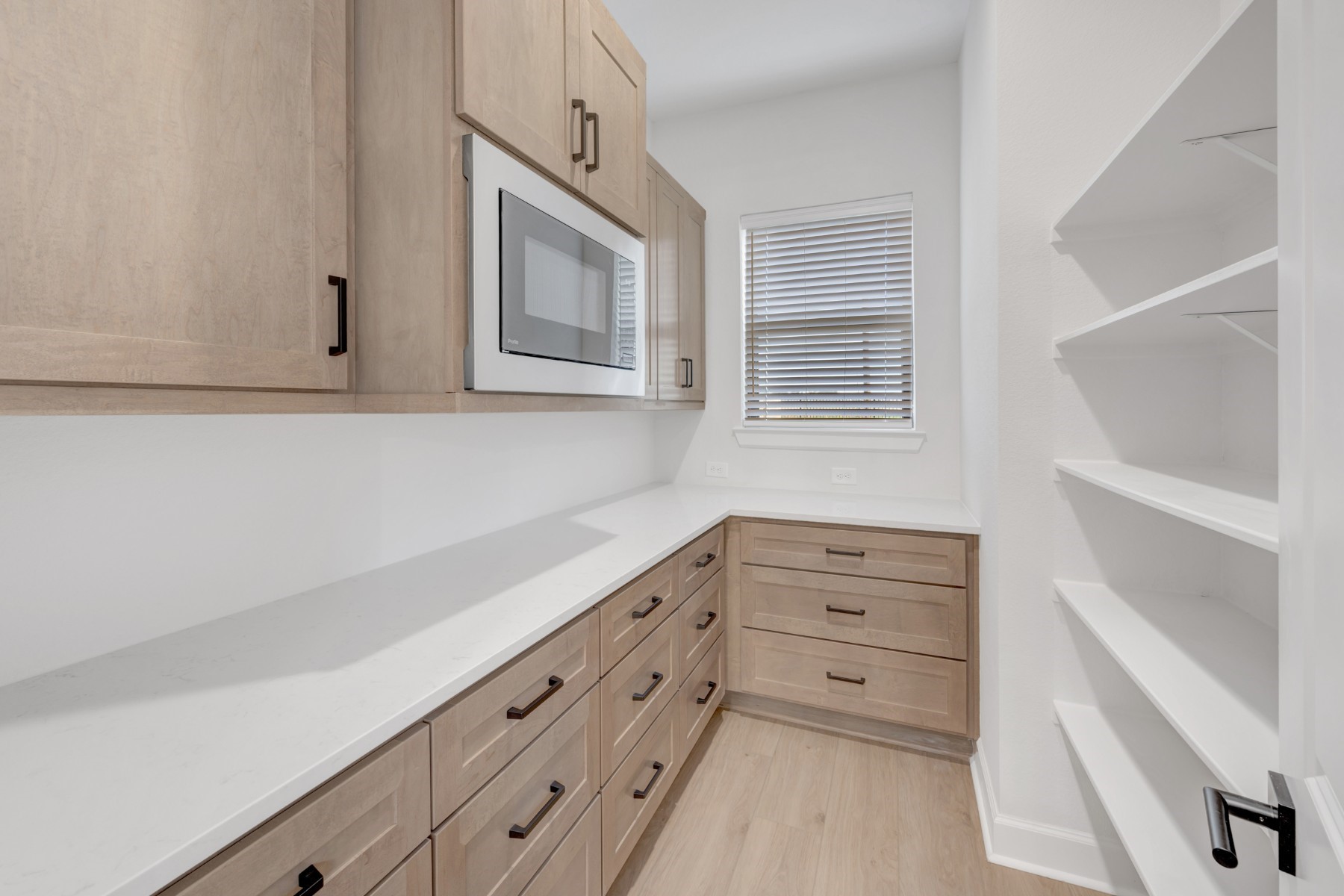18019 Lobos Point Lane Conroe, TX 77302 - Photo 21 of 49 a view of an empty room with cabinet and mirror