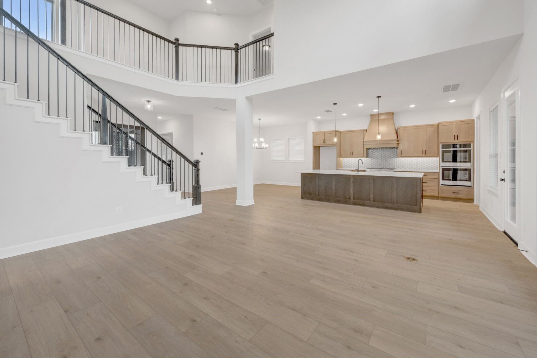 18019 Lobos Point Lane Conroe, TX 77302 - Photo 25 of 49 a view of a living room and kitchen with furniture