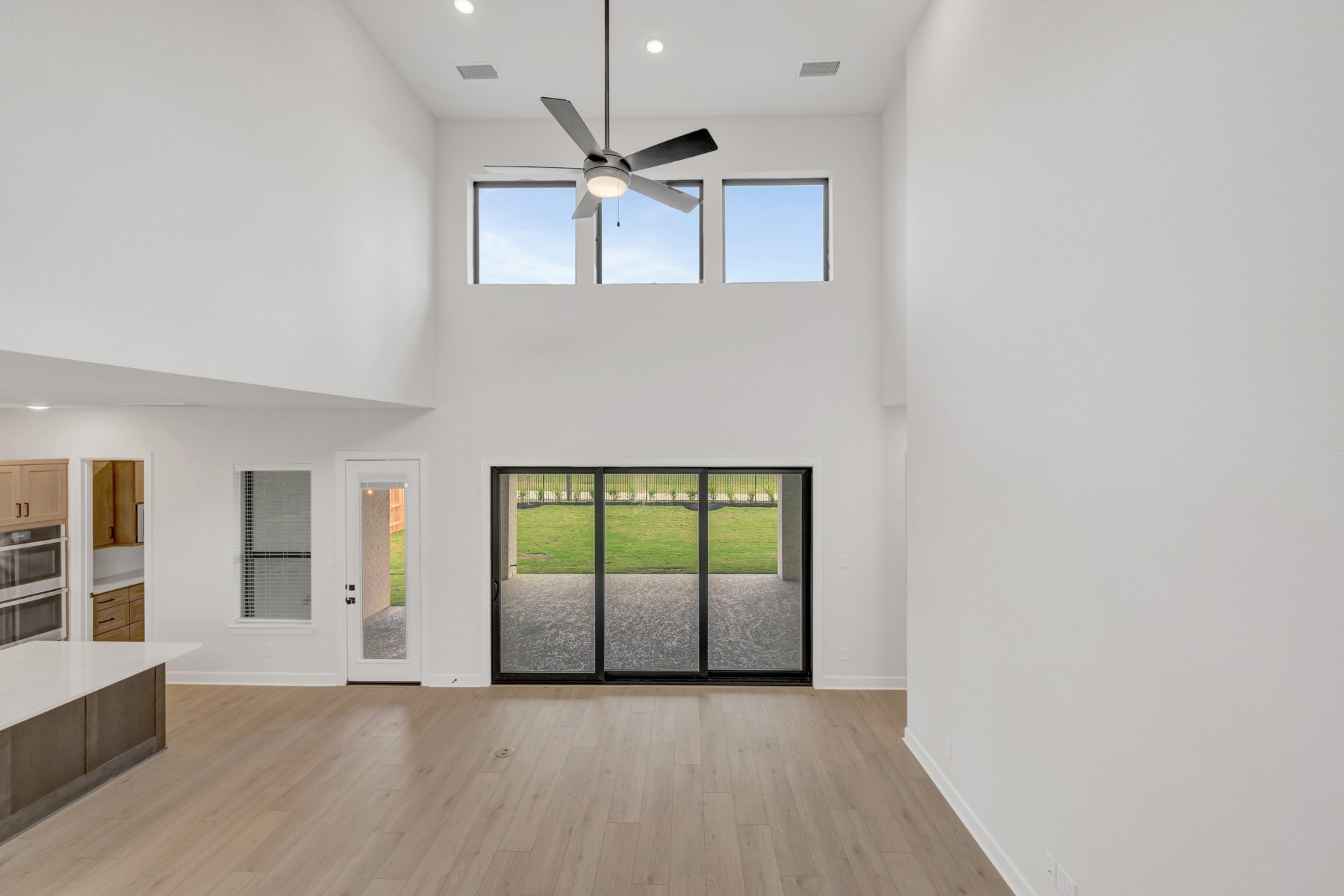 18019 Lobos Point Lane Conroe, TX 77302 - Photo 27 of 49 wooden floor in an empty room with a window