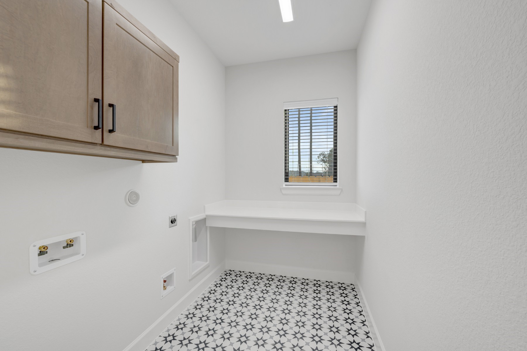18019 Lobos Point Lane Conroe, TX 77302 - Photo 29 of 49 a bathroom with a sink a toilet and a window