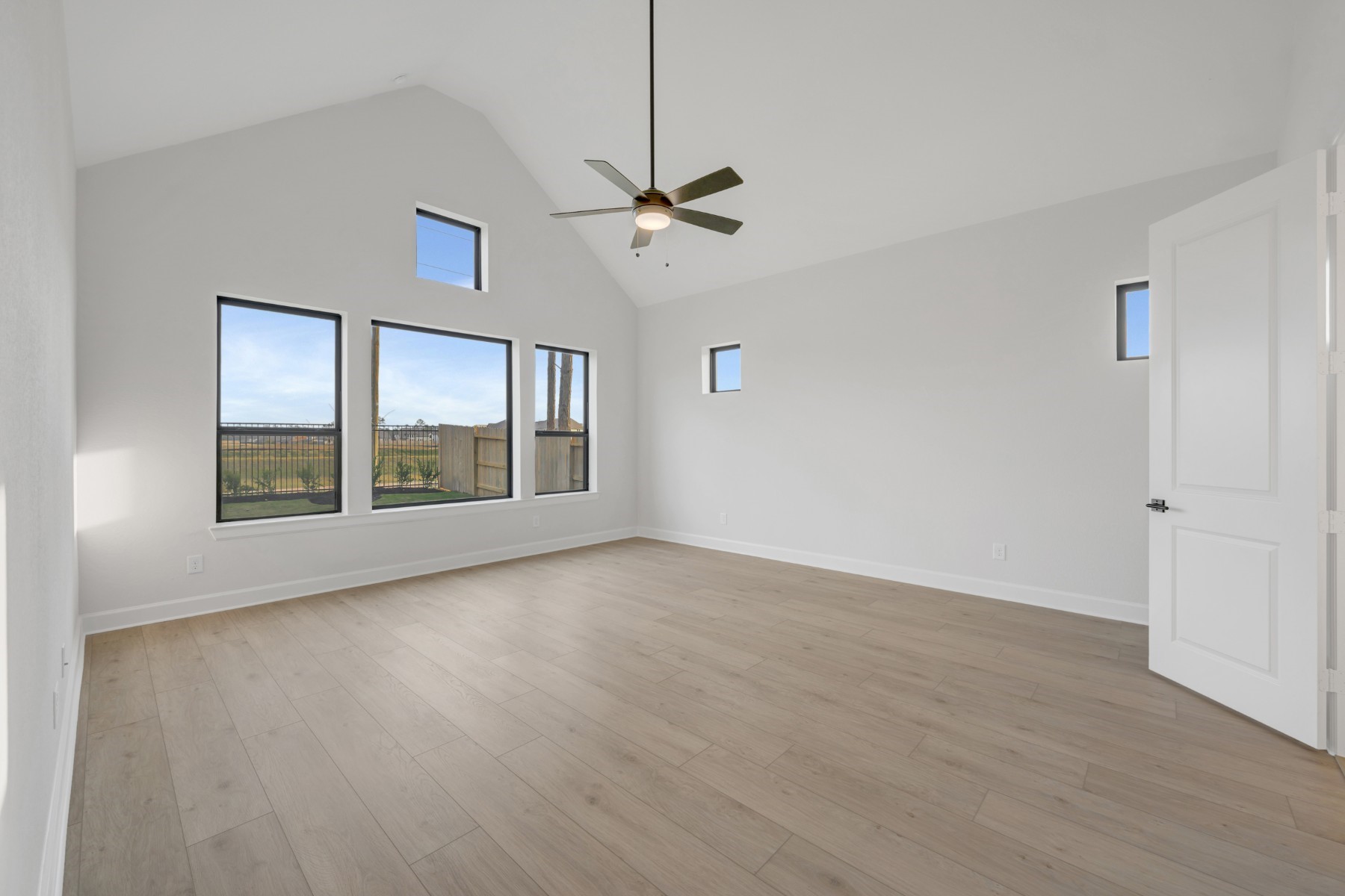 18019 Lobos Point Lane Conroe, TX 77302 - Photo 30 of 49 wooden floor in an empty room with a window