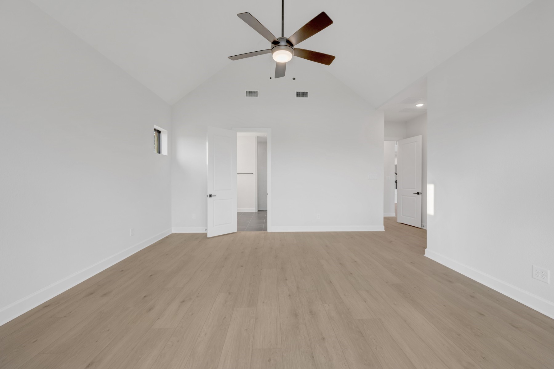 18019 Lobos Point Lane Conroe, TX 77302 - Photo 31 of 49 a view of an empty room with a ceiling fan