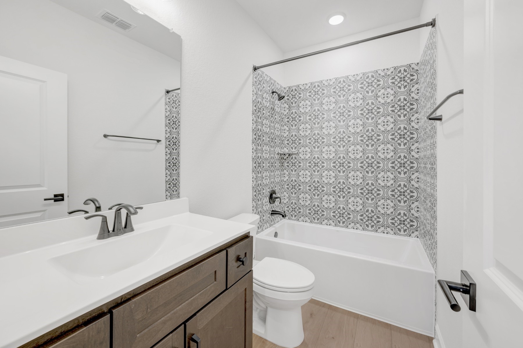 18019 Lobos Point Lane Conroe, TX 77302 - Photo 36 of 49 a bathroom with a sink a toilet and shower