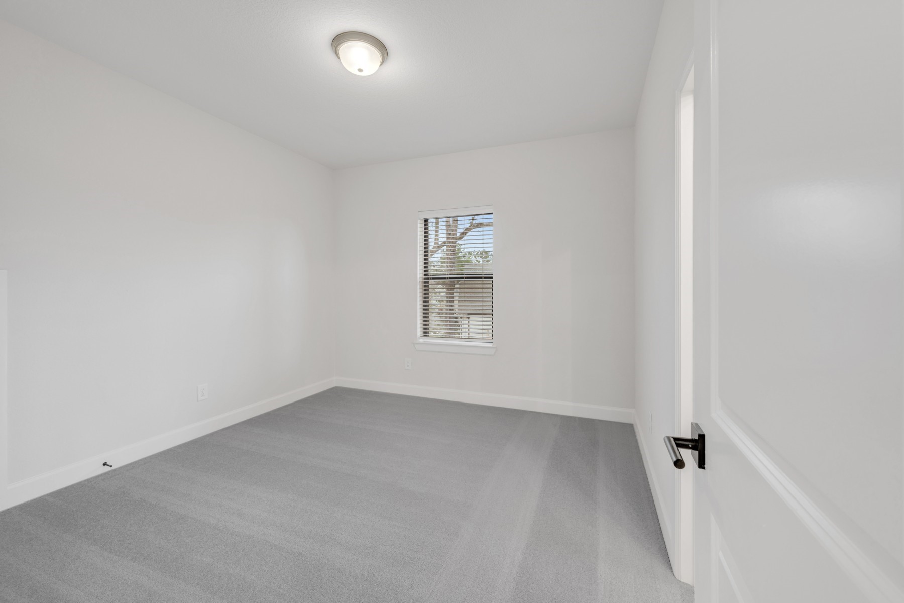 18019 Lobos Point Lane Conroe, TX 77302 - Photo 38 of 49 an empty room with a window