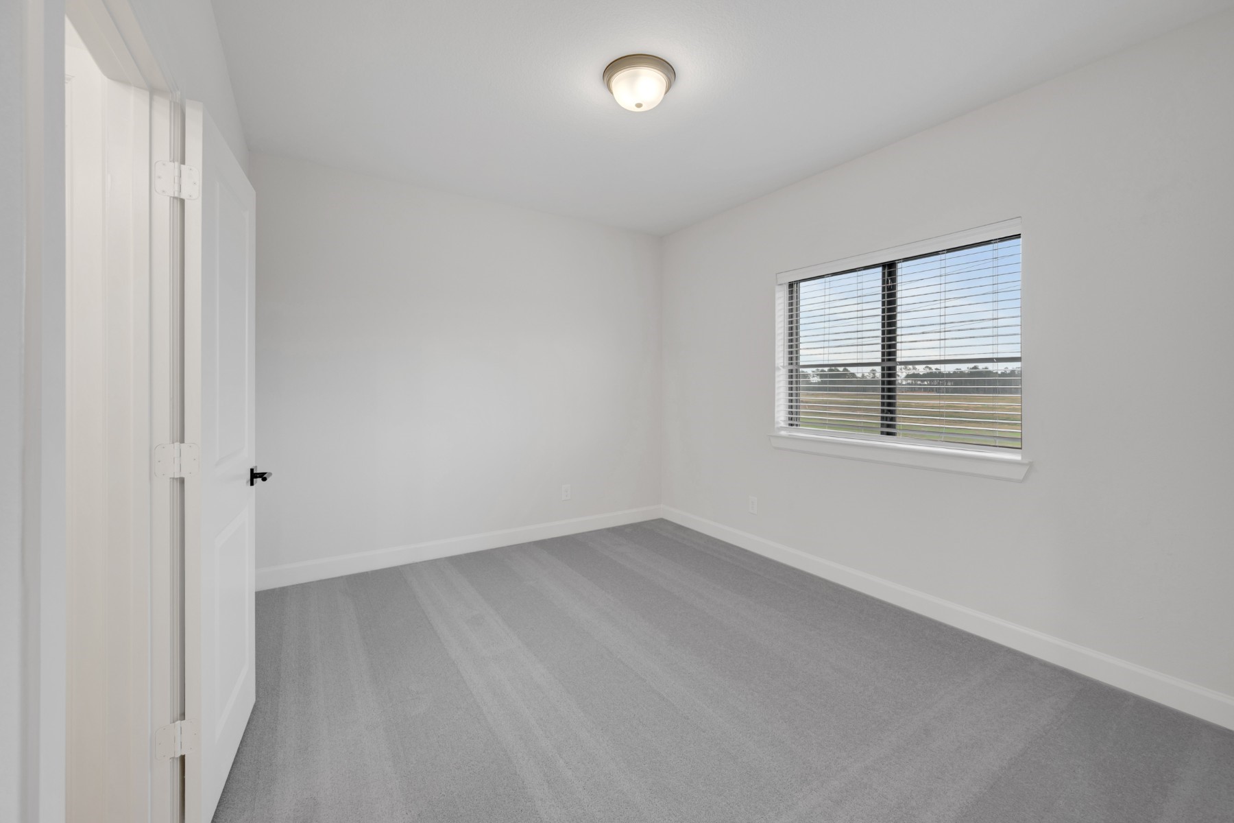 18019 Lobos Point Lane Conroe, TX 77302 - Photo 43 of 49 an empty room with windows