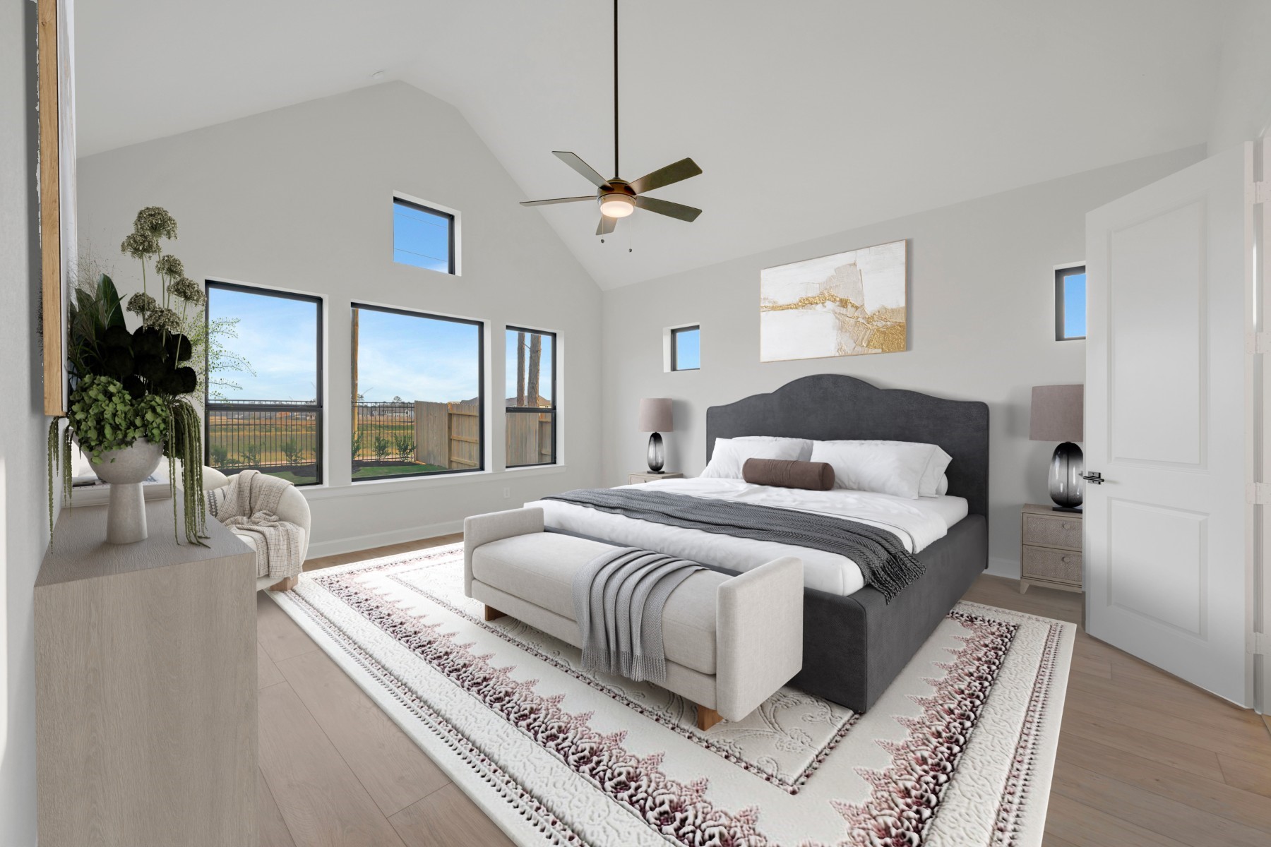 18019 Lobos Point Lane Conroe, TX 77302 - Photo 6 of 49 a bedroom with a large bed and a chandelier