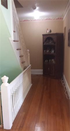 372 Sumner Avenue Springfield, MA 01108 - Photo 16 of 30 a view of a hallway with stairs