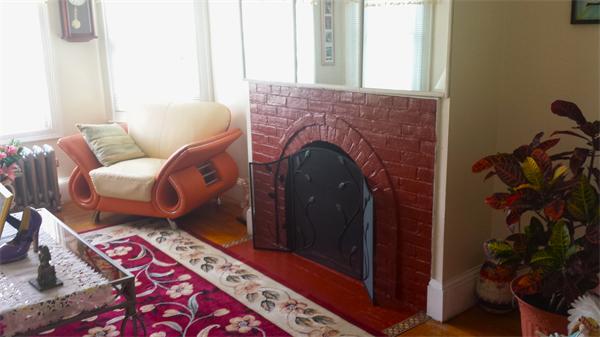 372 Sumner Avenue Springfield, MA 01108 - Photo 8 of 30 a living room with furniture and a fireplace