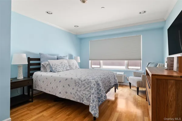 a bedroom with a bed and a table