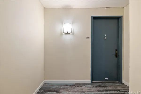 a view of a hallway with paintings on the wall