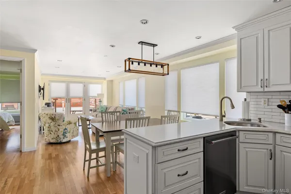 a kitchen with center island cabinets and a window