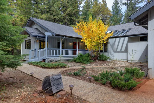 a front view of a house with garden