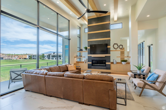 3606 South Cypress Road Hurricane, UT 84737 - Photo 13 of 69 Living room featuring recessed lighting, a large fireplace, light marble finish floors, and a ceiling fan