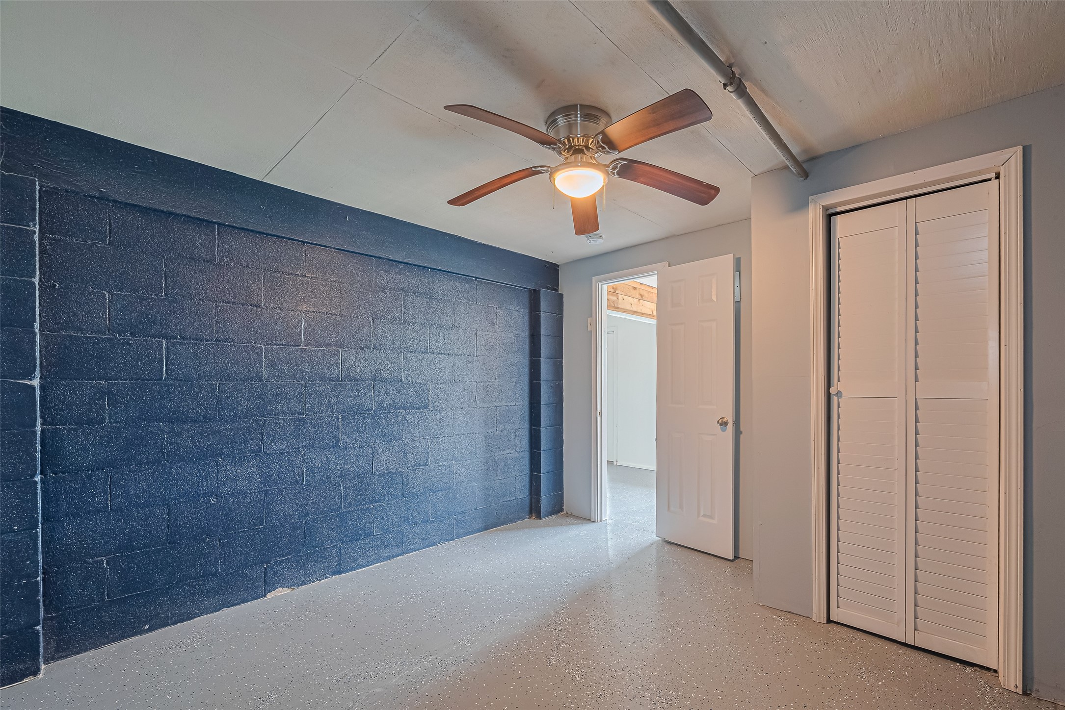 228 Barracuda Street Bayou Vista, TX 77563 - Photo 26 of 44 a view of a hallway with a chandelier fan