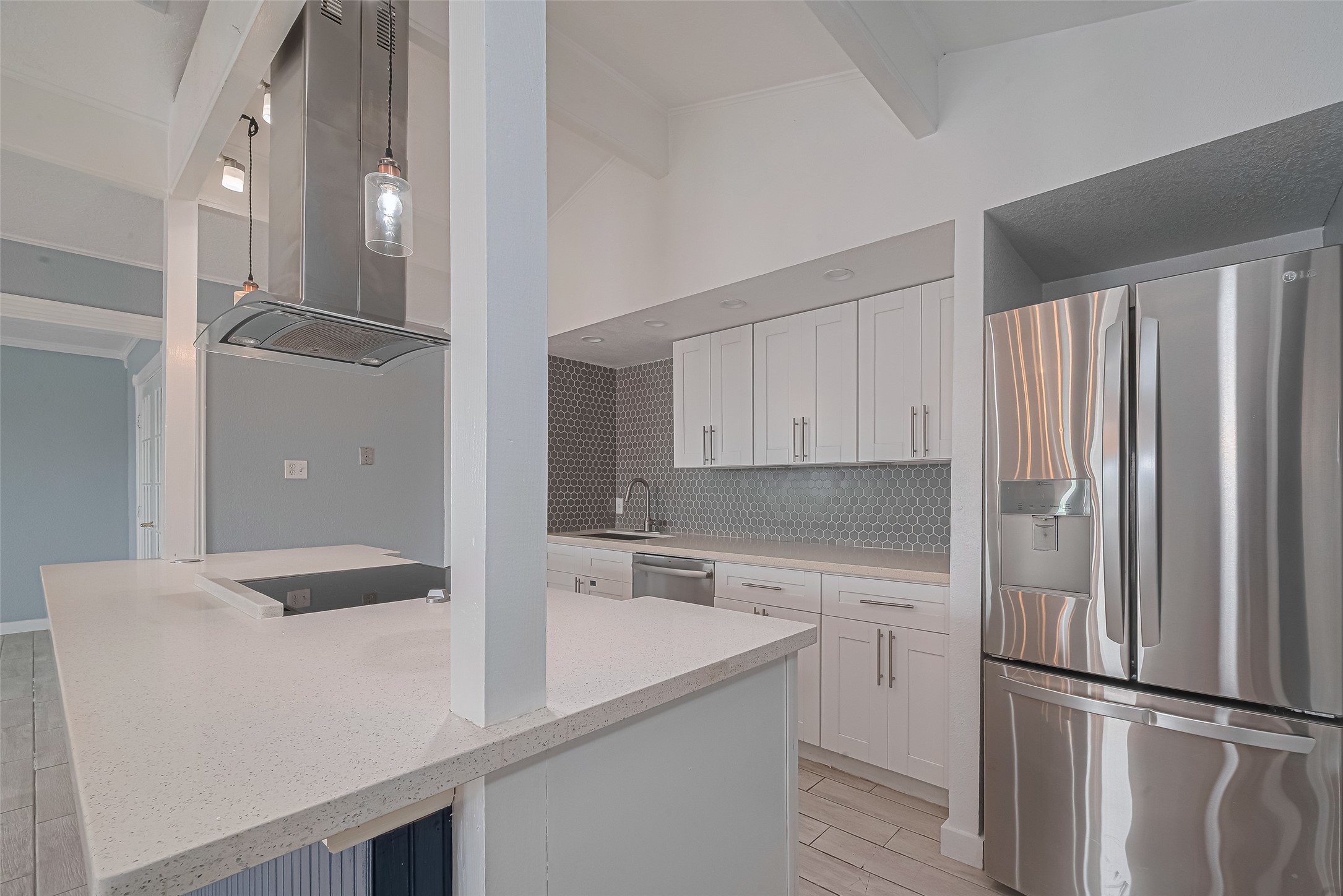 228 Barracuda Street Bayou Vista, TX 77563 - Photo 5 of 44 a kitchen with a sink and white cabinets