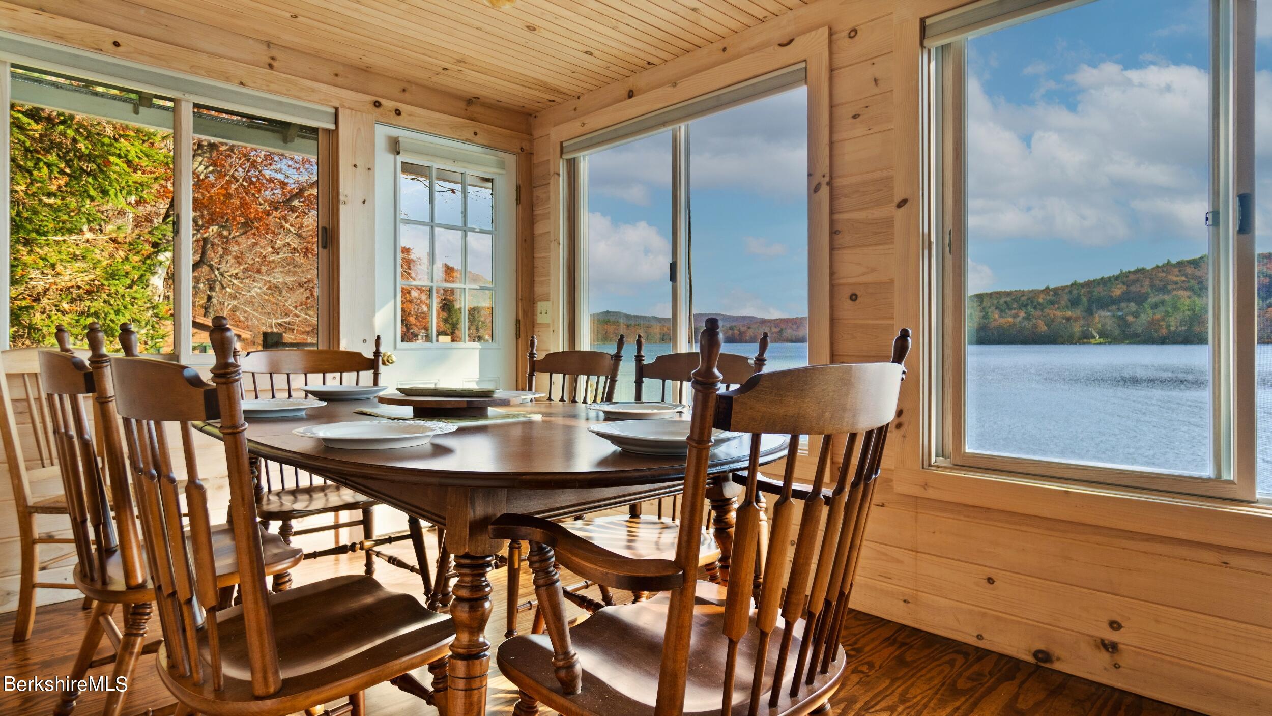 16 Chanterwood Road Lee, MA 01238 - Photo 7 of 27 a view of a dining room with furniture large windows and wooden floor
