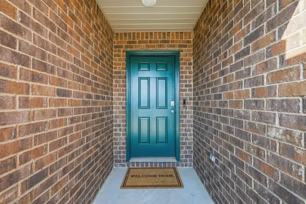 a view of a brick house with a door