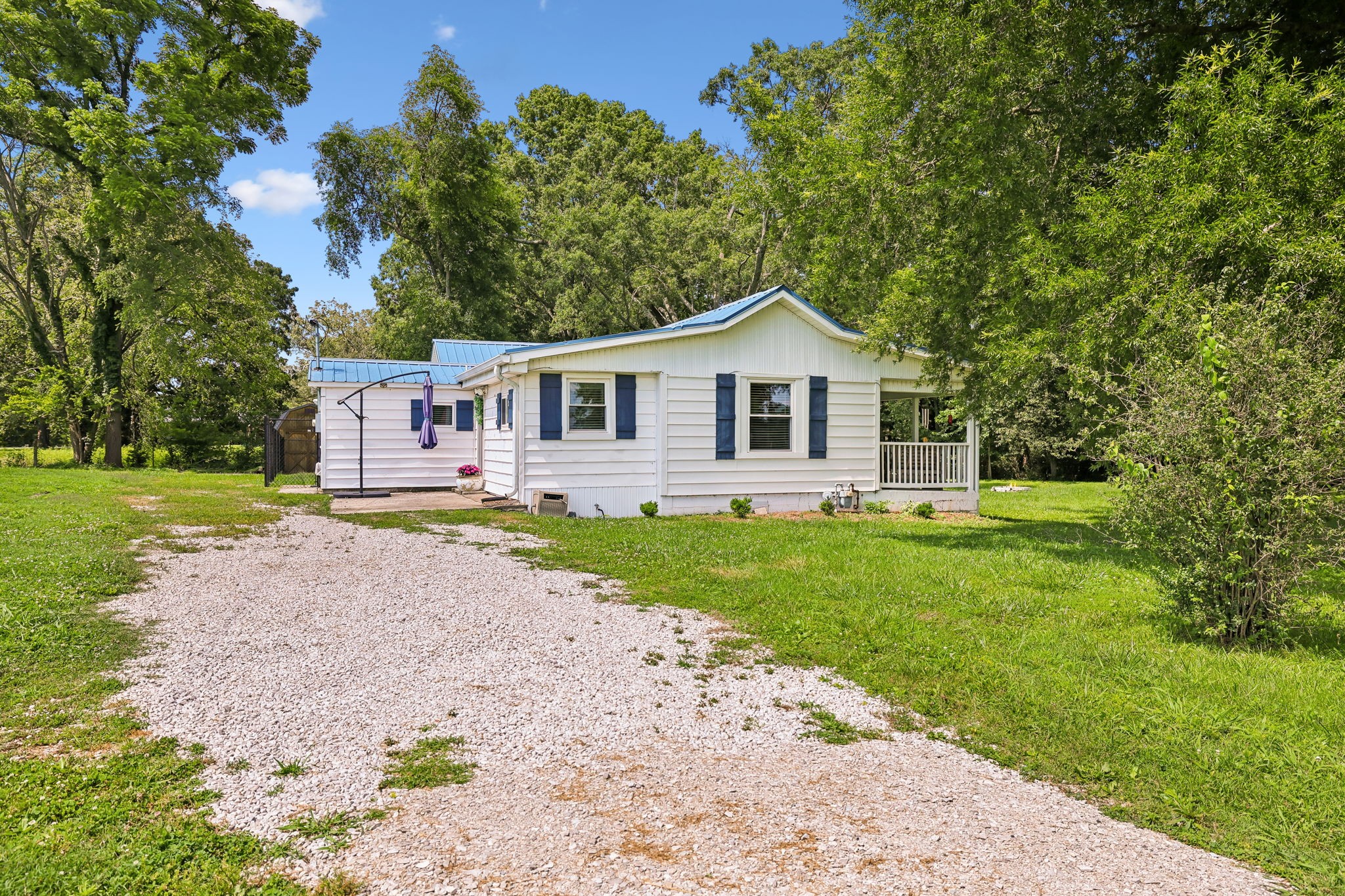 1466 Bible Crossing Road Winchester, TN 37398 - Photo 41 of 42 a front view of a house with a garden and yard