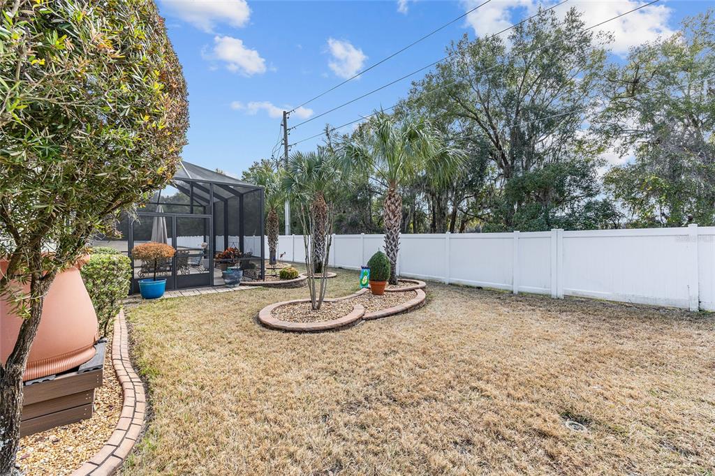 16339 Southwest 14th Avenue Road Ocala, FL 34473 - Photo 21 of 22 a backyard of a house with table and chairs