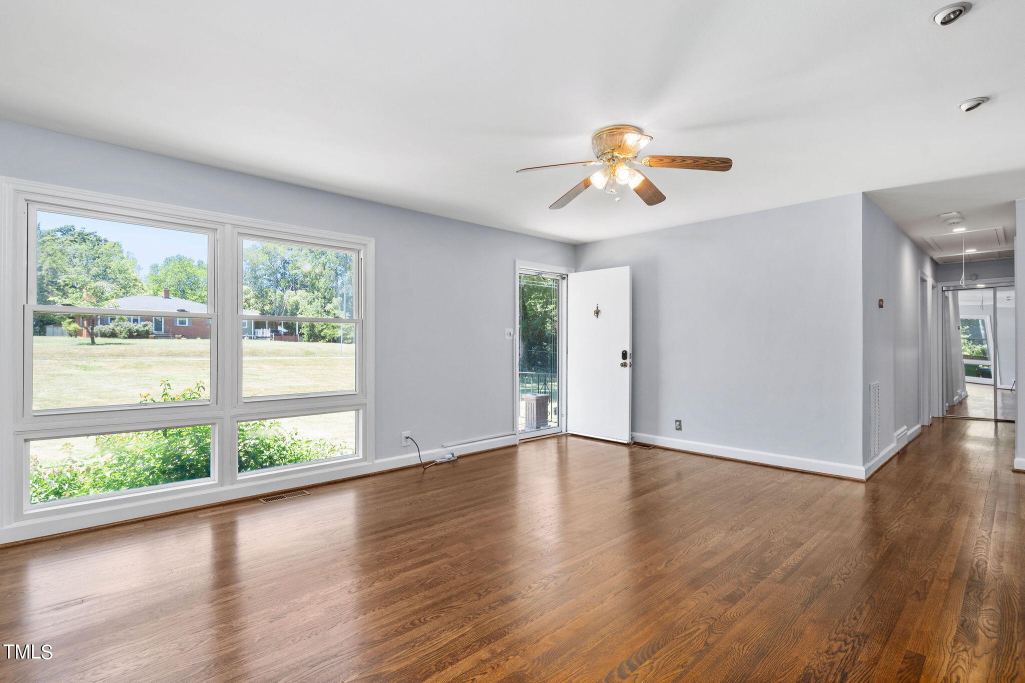 126 Clarendon Crescent Raleigh, NC 27610 - Photo 17 of 40 a view of a room with wooden floor and a window