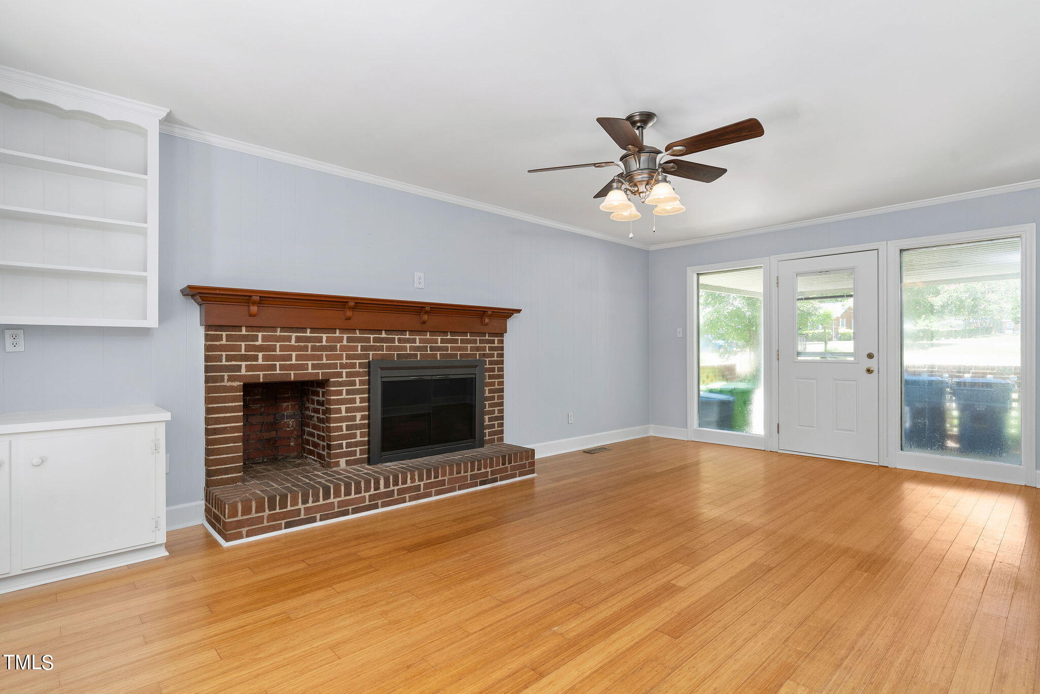 126 Clarendon Crescent Raleigh, NC 27610 - Photo 23 of 40 a view of an empty room with window and wooden floor