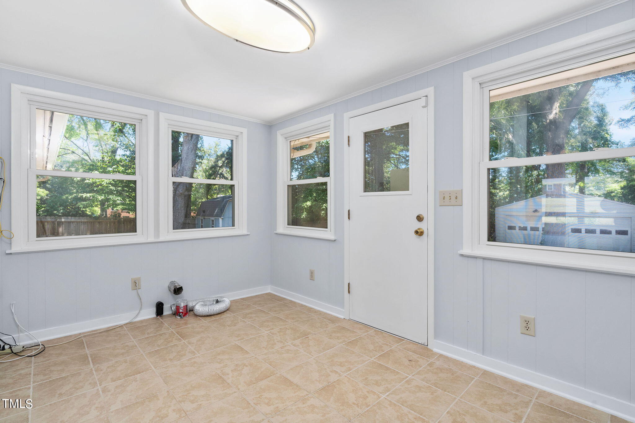 126 Clarendon Crescent Raleigh, NC 27610 - Photo 26 of 40 a view of a livingroom with an empty space and a window