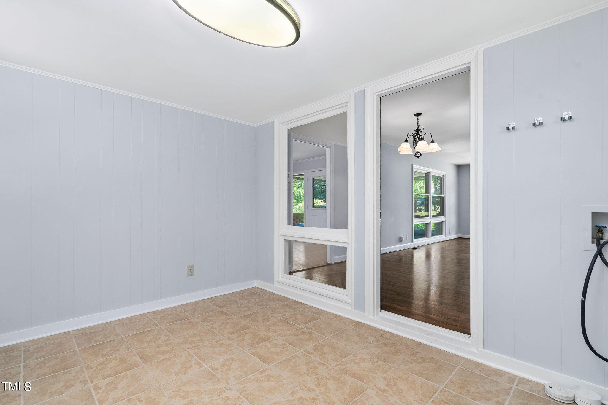 126 Clarendon Crescent Raleigh, NC 27610 - Photo 27 of 40 an empty room with windows and entrance
