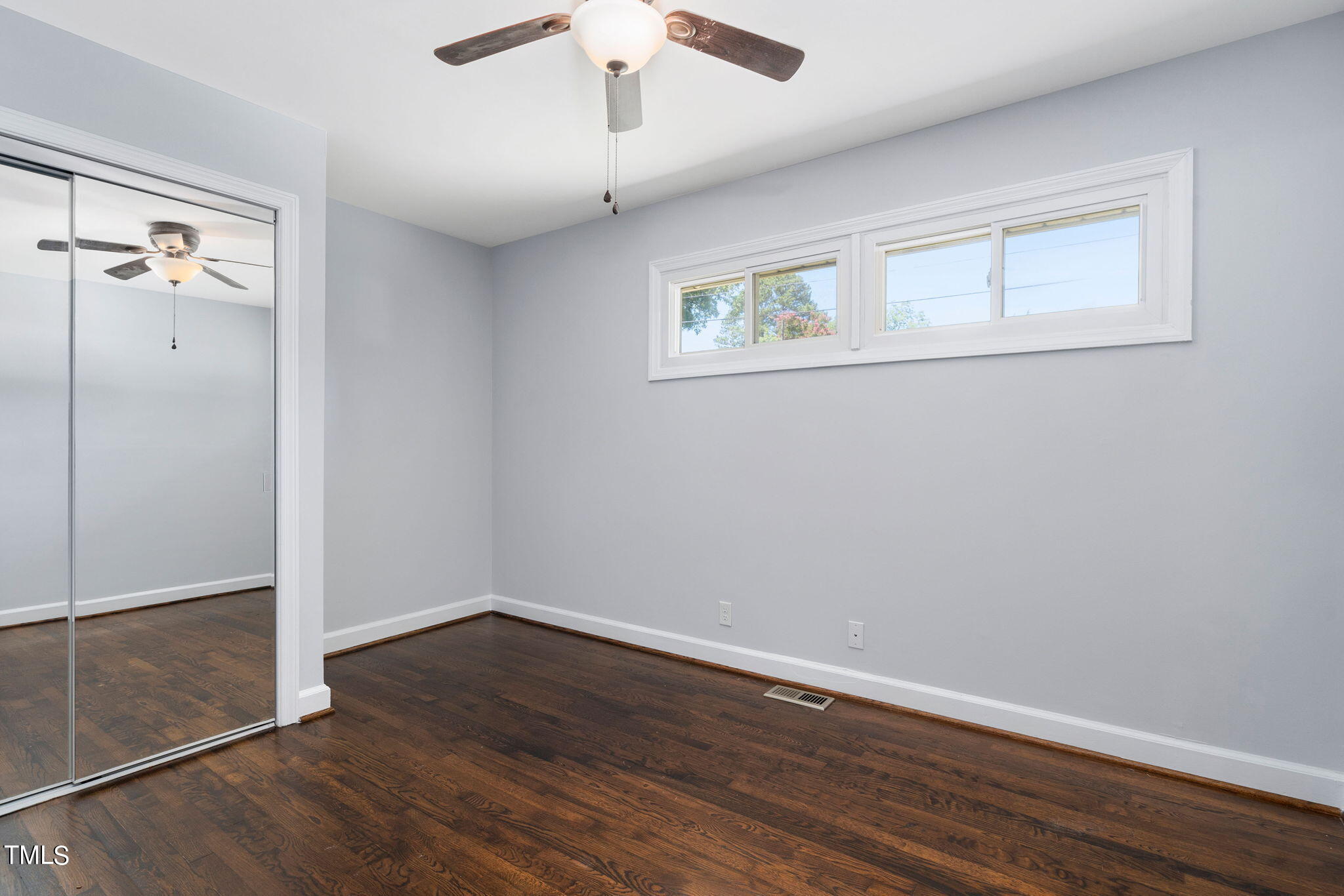 126 Clarendon Crescent Raleigh, NC 27610 - Photo 38 of 40 a view of an empty room with wooden floor