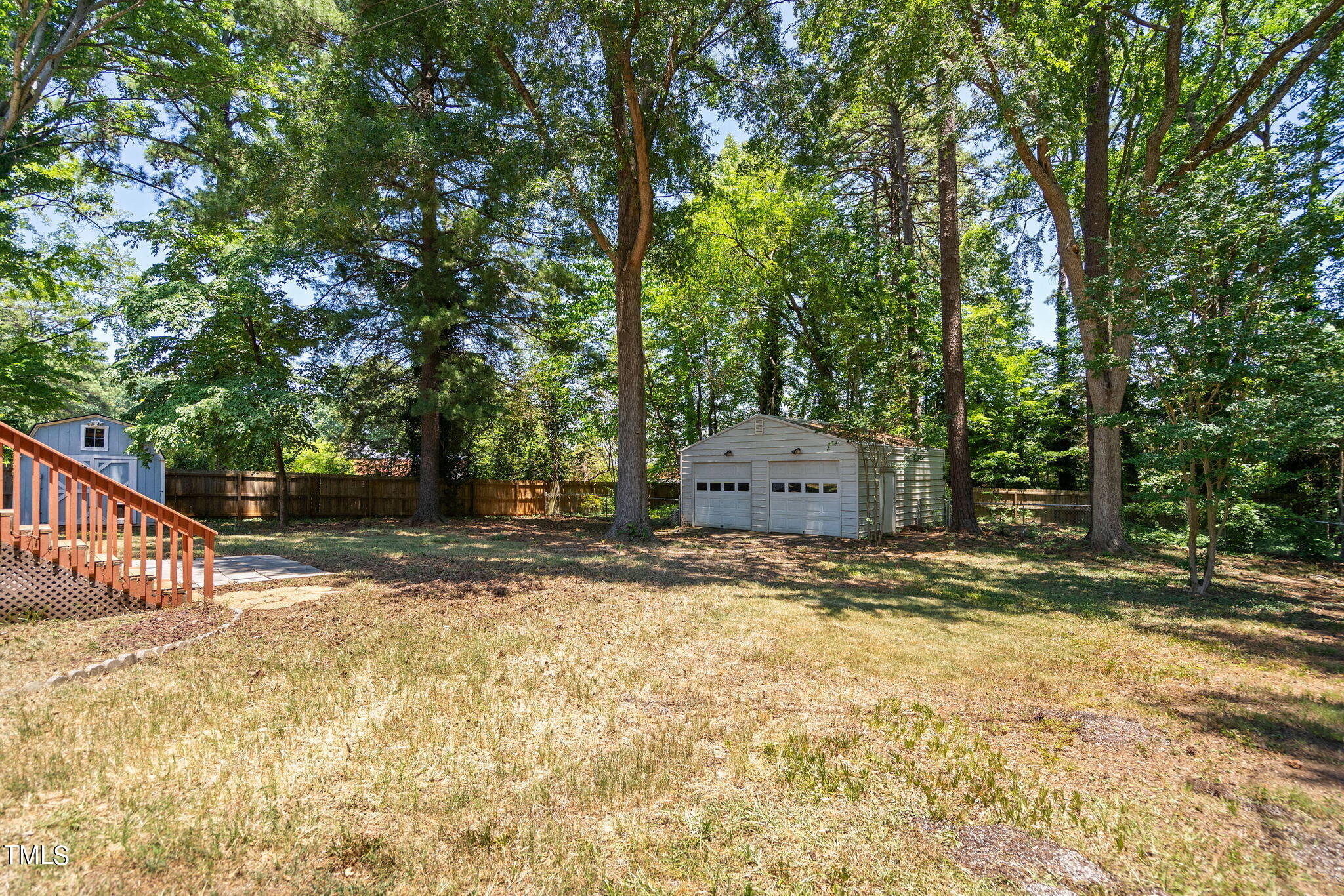 126 Clarendon Crescent Raleigh, NC 27610 - Photo 7 of 40 a view of a yard with large trees