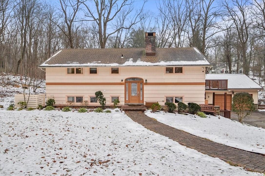 111 Commodore Road Chappaqua, NY 10514 - Photo 1 of 1 a view of a house with a snow in the yard