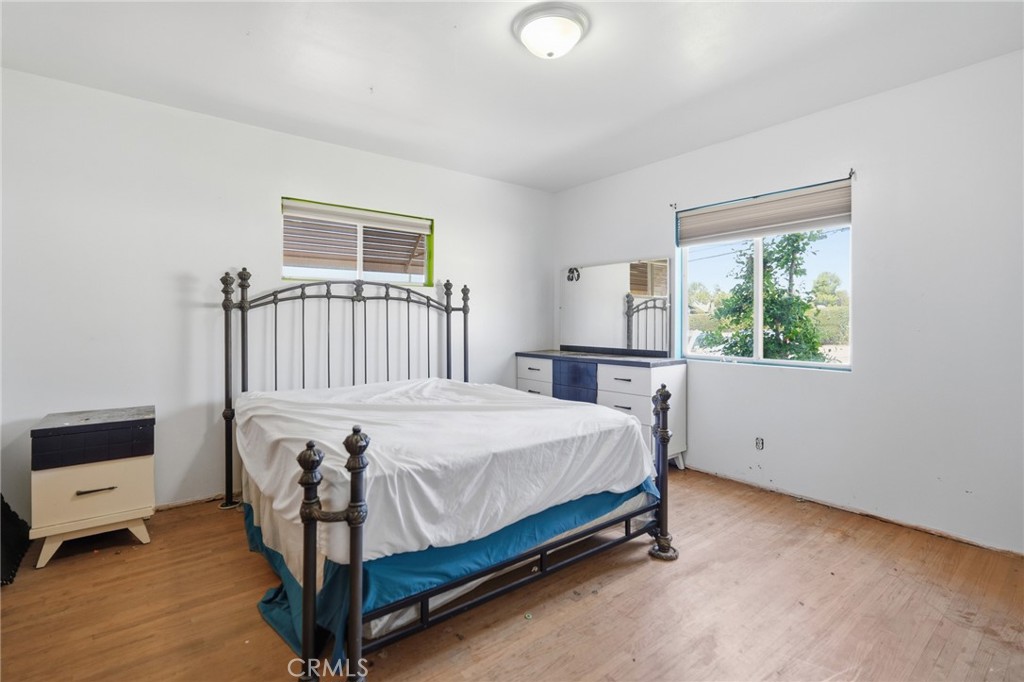 183 East County Line Road Calimesa, CA 92320 - Photo 12 of 31 a bed sitting in a bedroom next to a window